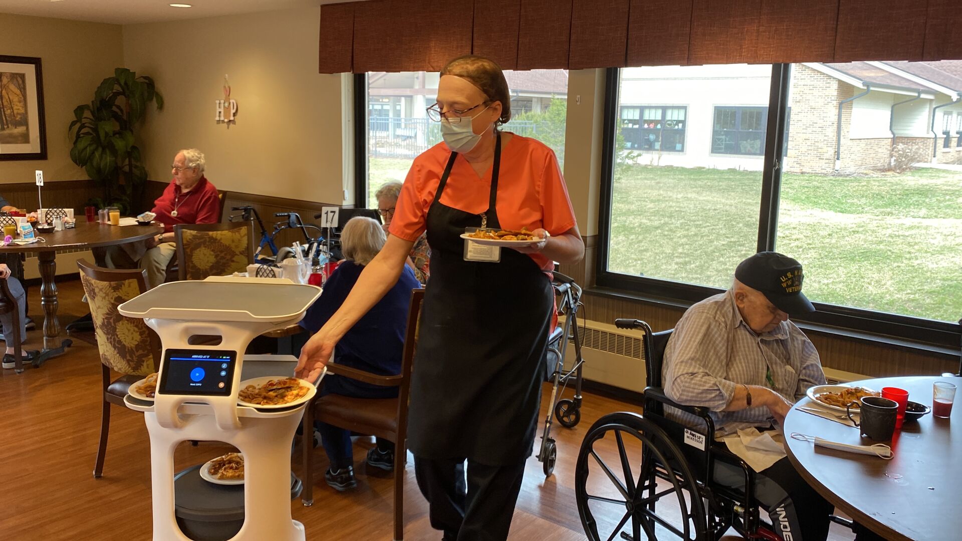 Anne Bodeau grabs plates